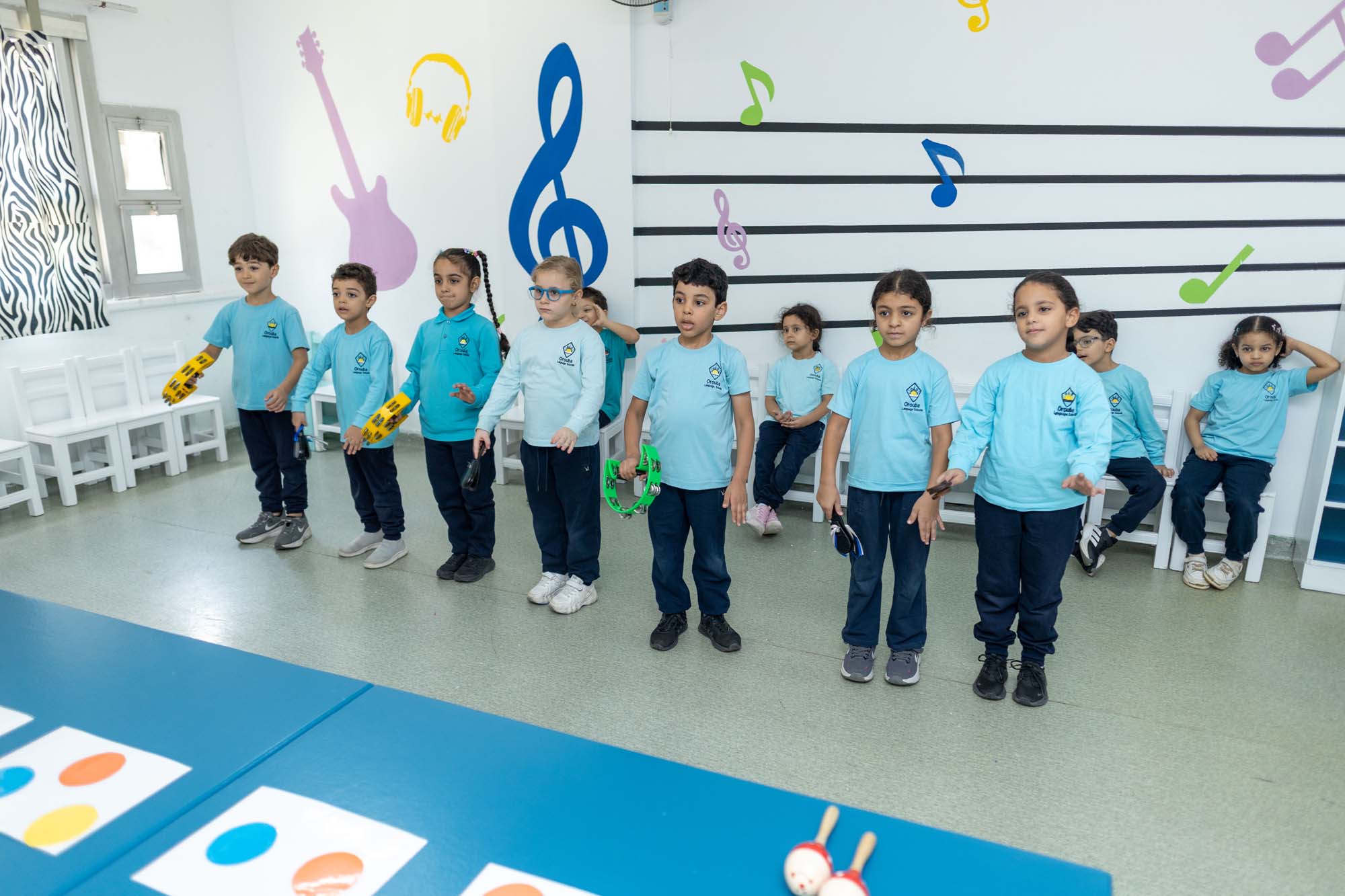 OLS — Music, movement and confidence Kindergarten children singing together in the OLS music room
