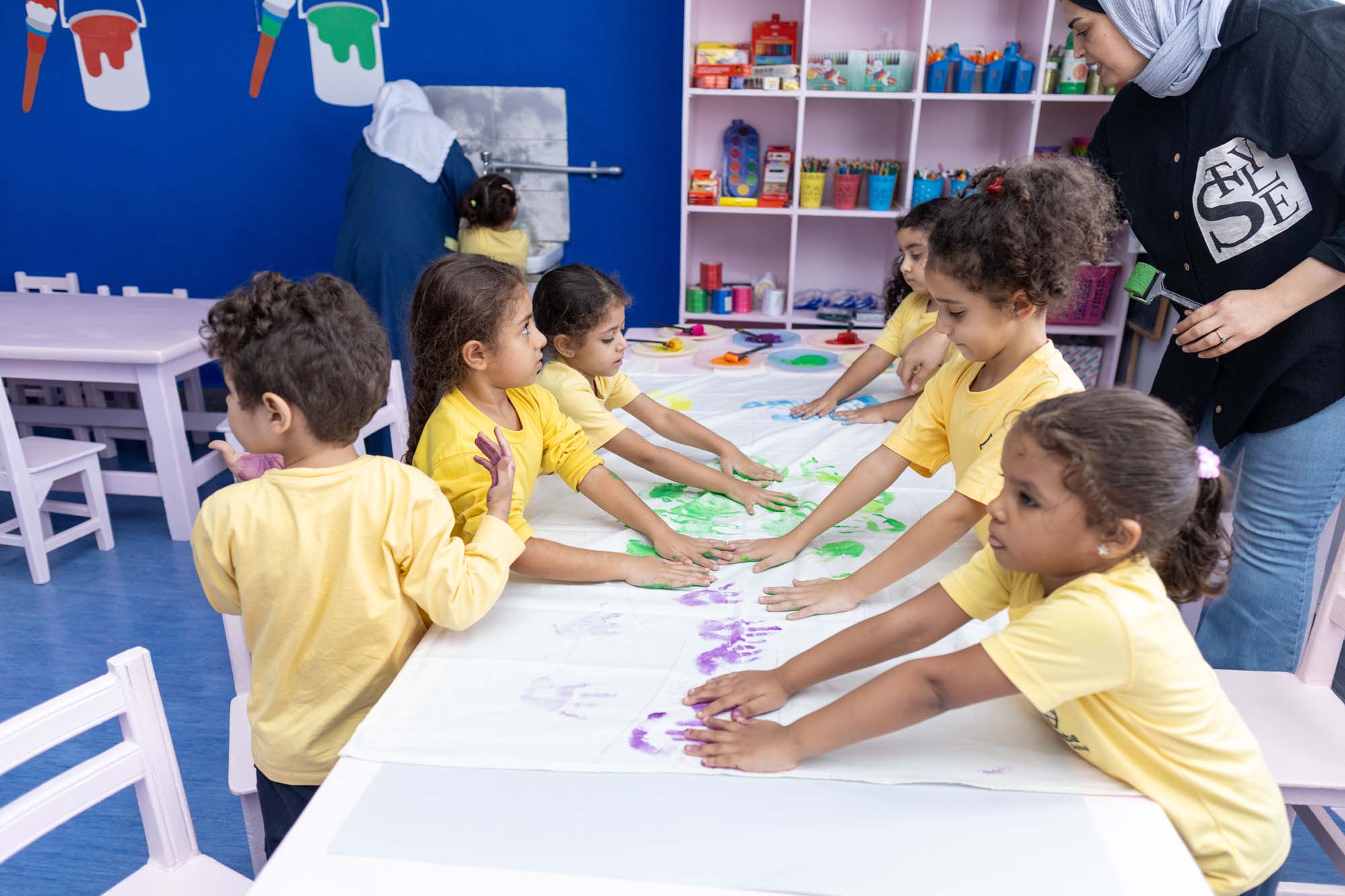 Kindergarten children taking part in a shared classroom activity