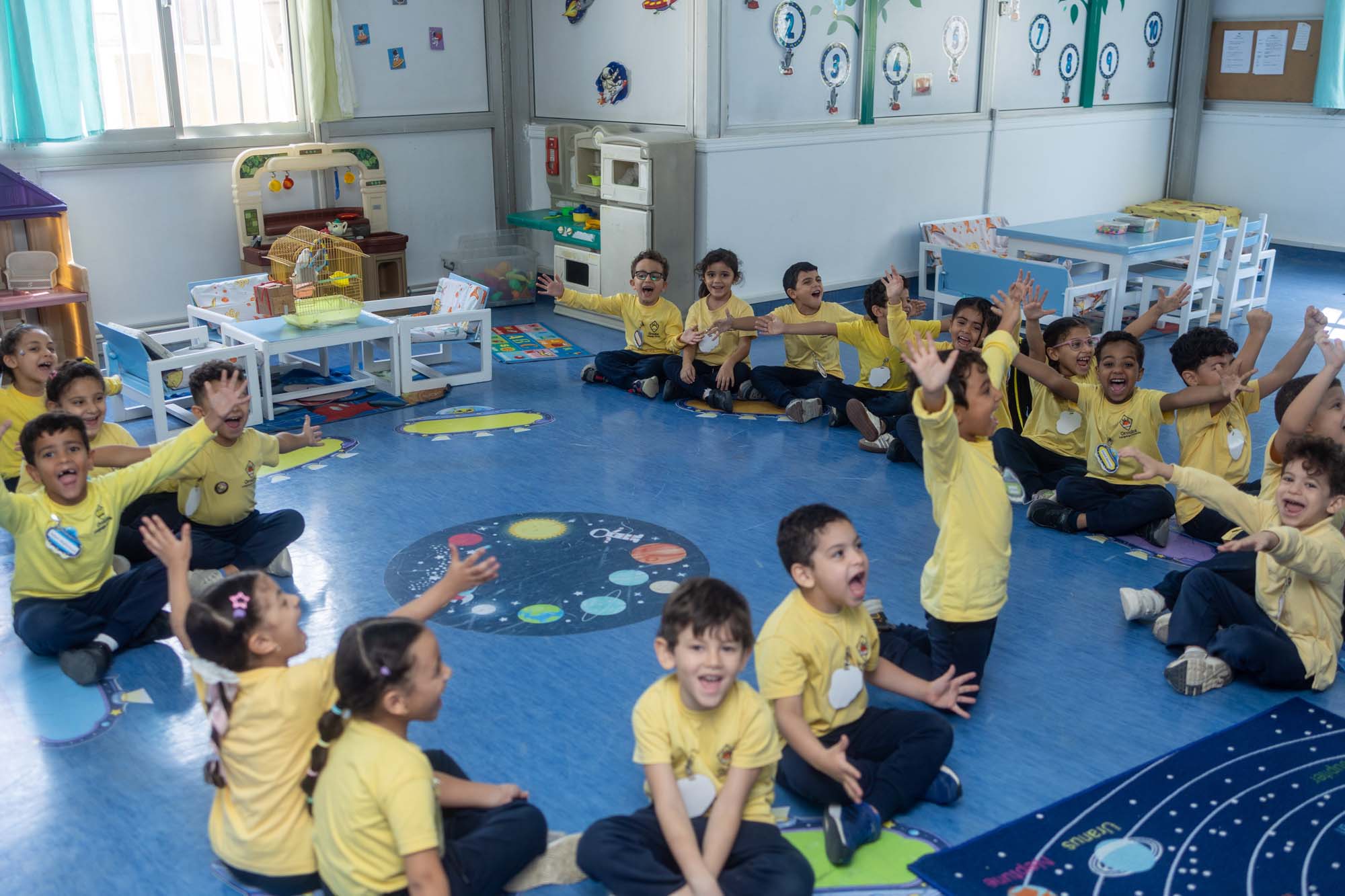 Kindergarten children sitting together for a classroom group activity