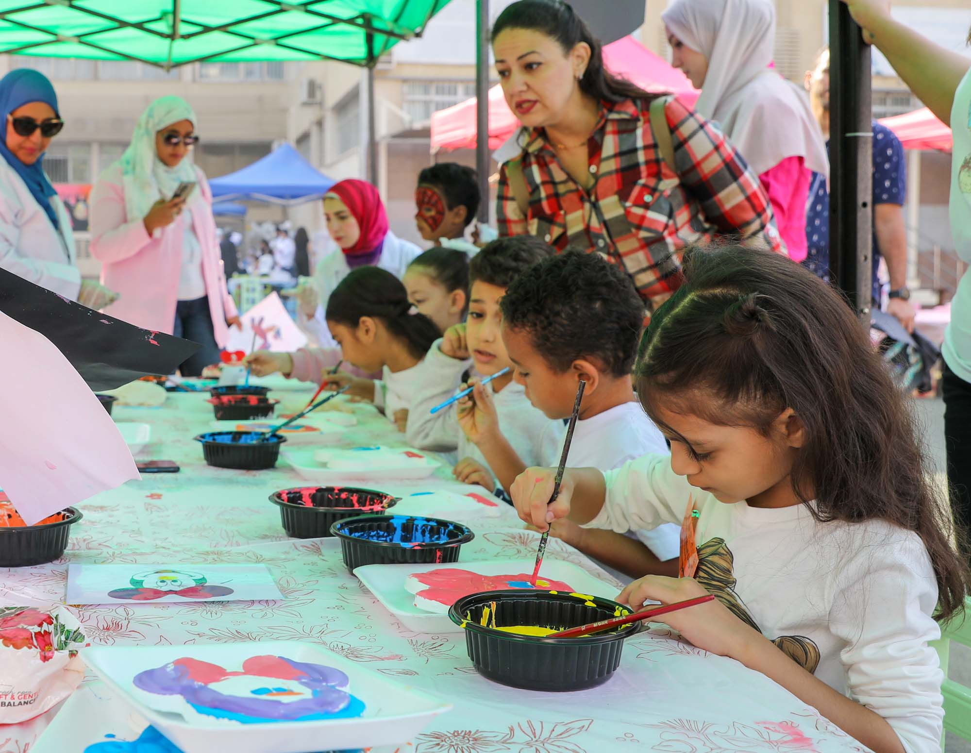 OLS pupils concentrating on painting during a colour workshop